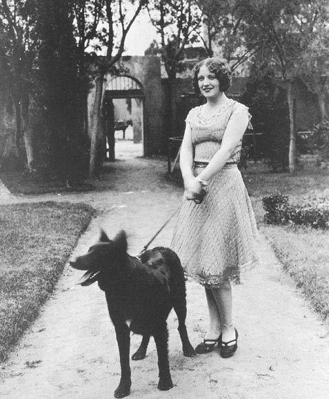 1926, with her Belgian police dog.