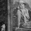 1926, 'Tramp, Tramp, Tramp.' Harry admires Betty (Joan) on a billboard.