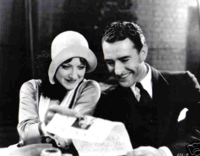 With John Gilbert on the set of 'Four Walls.'