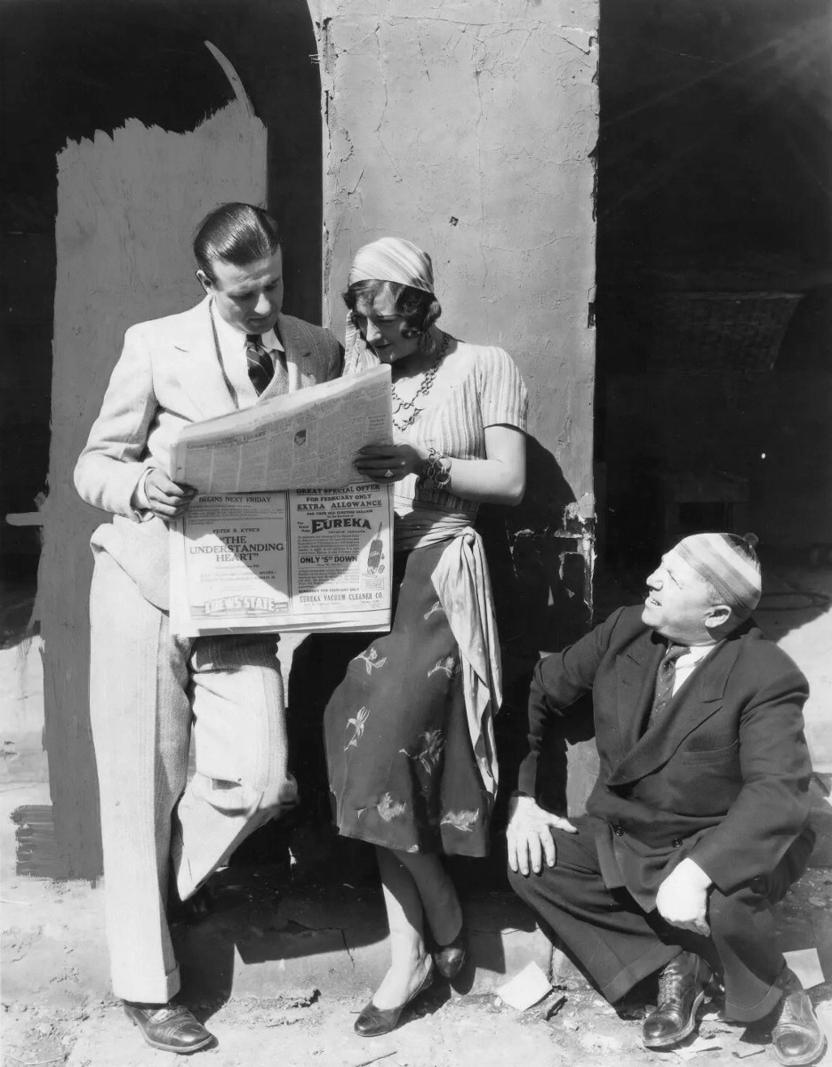 1927. On the set of 'The Unknown.' With ad for Joan's 'The Understanding Heart' on back page of paper.