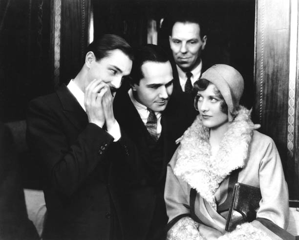 With unknown players and William Haines, center.