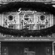 1930. Two photos (big and small) with Season's Greetings from Joan at an LA marquee for 'Paid.'