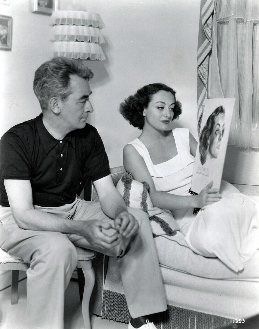 With artiist James Montgomery Flagg and his portrait of her. Shot by Bud Graybill.