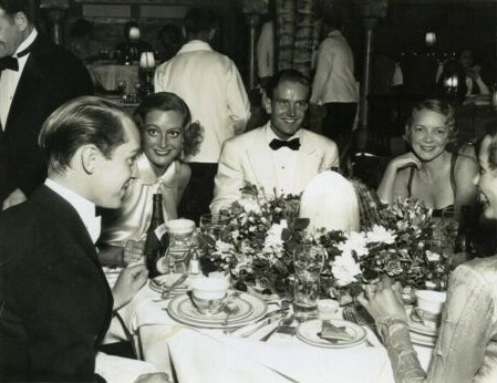 June 1933. With Franchot Tone, left, and Helen Hayes, upper right.