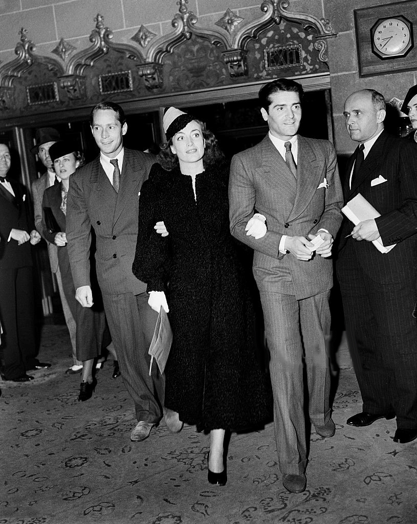 1936. At unknown event with husband Franchot Tone, left, and actor Francis Lederer.