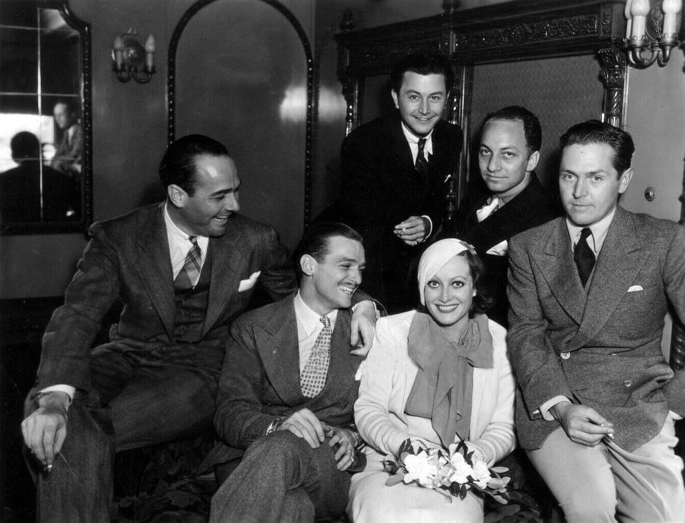 1932. Arriving back in California on the 'Chief' train. With William Haines, husband Doug, Robert Young, Jerry Asher, and Alexander Kirkland.