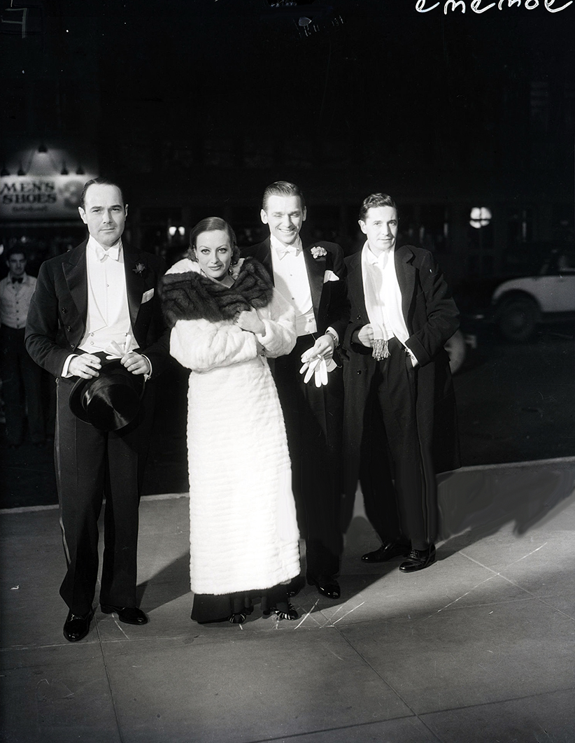 1931. At a premiere with William Haines, husband Doug Fairbanks, Jr., and Ivor Novello.