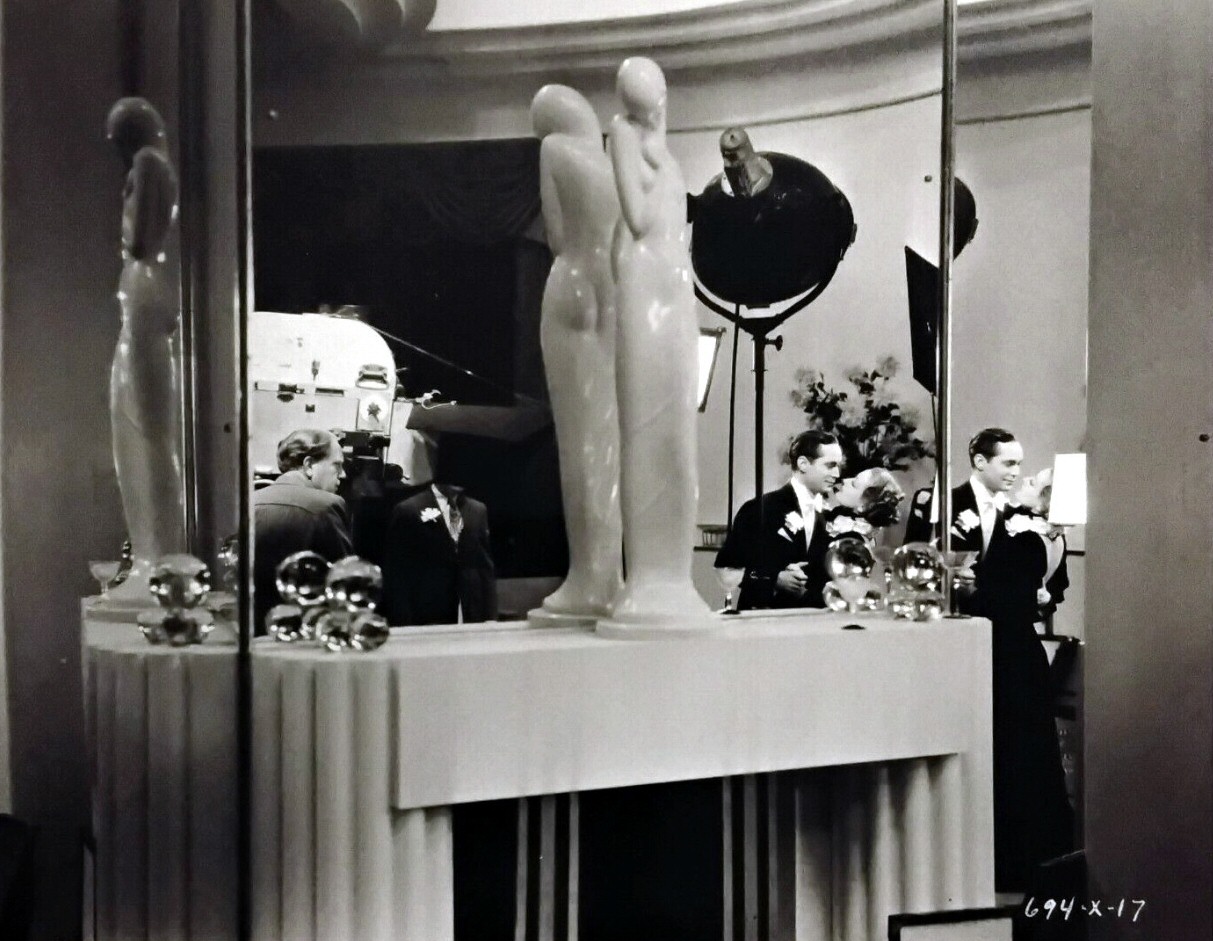 1933. Filming 'Dancing Lady.' With director Leonard and Franchot Tone.