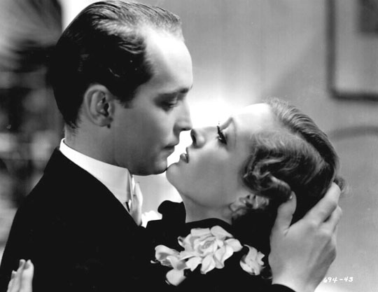 With Franchot Tone.