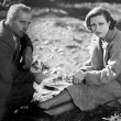 1933. On the set of 'Today We Live' with director Howard Hawks. (Includes press caption.)
