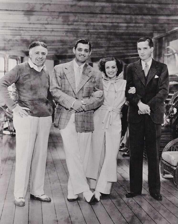 1934. On the set of 'Chained' with director Brown, Gable, and writer John Lee Mahin.