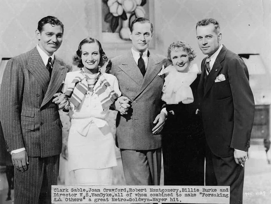 1934. On the set of 'Forsaking All Others.' With Gable, Montgomery, Billie Burke, and director Van Dyke.