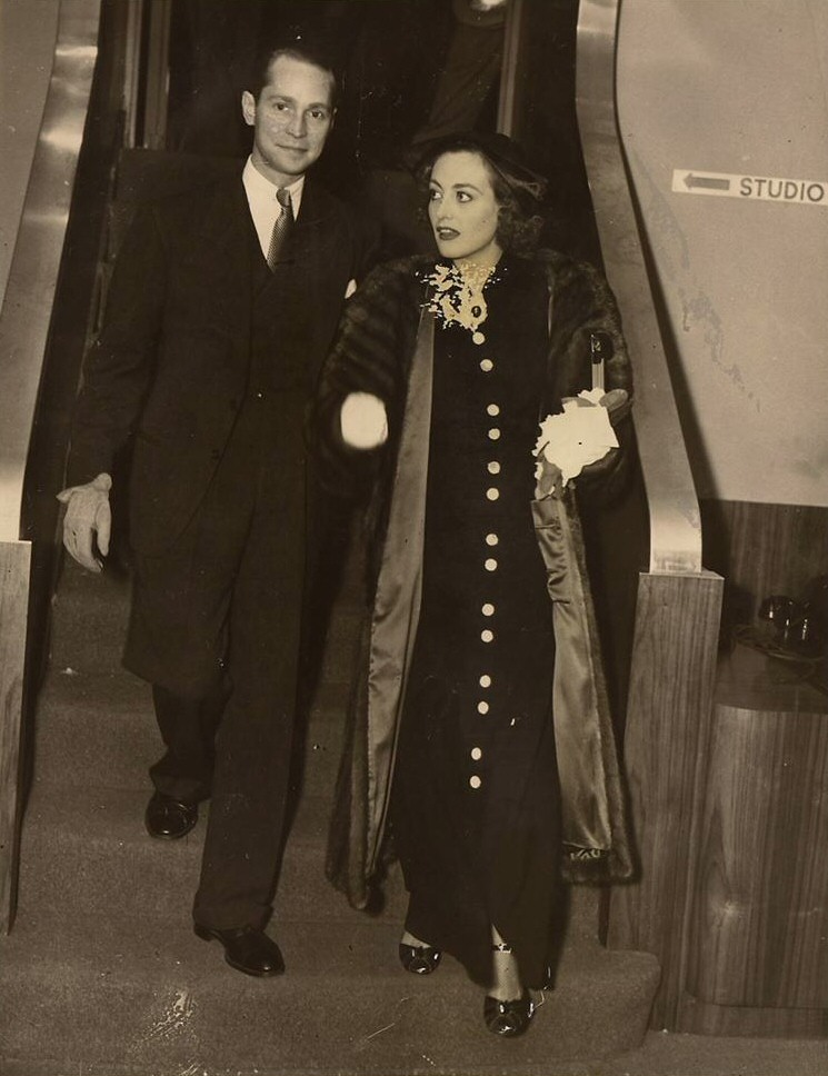 10/14/35. With husband Franchot Tone on the CBS radio set before performing 'Within the Law.'