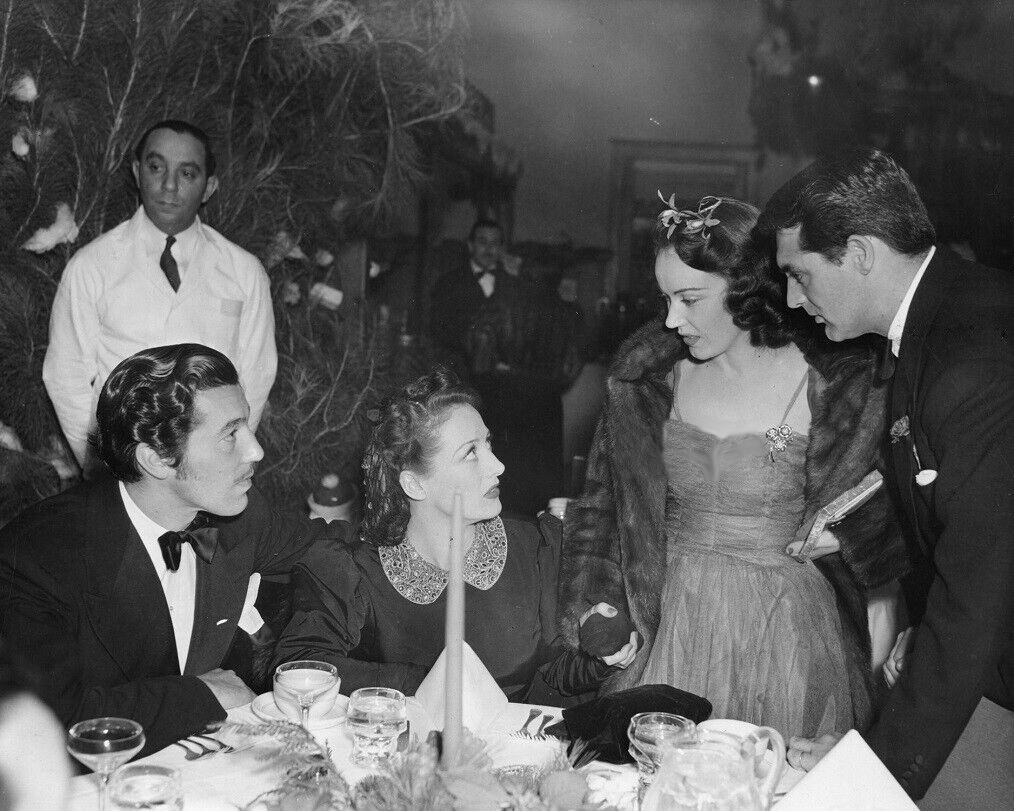 1935. At Mrs. Basil Rathbone's Hollywood Guild party at the Beverly Hills Hotel. With Cesar Romero, Fay Wray, and Cary Grant.