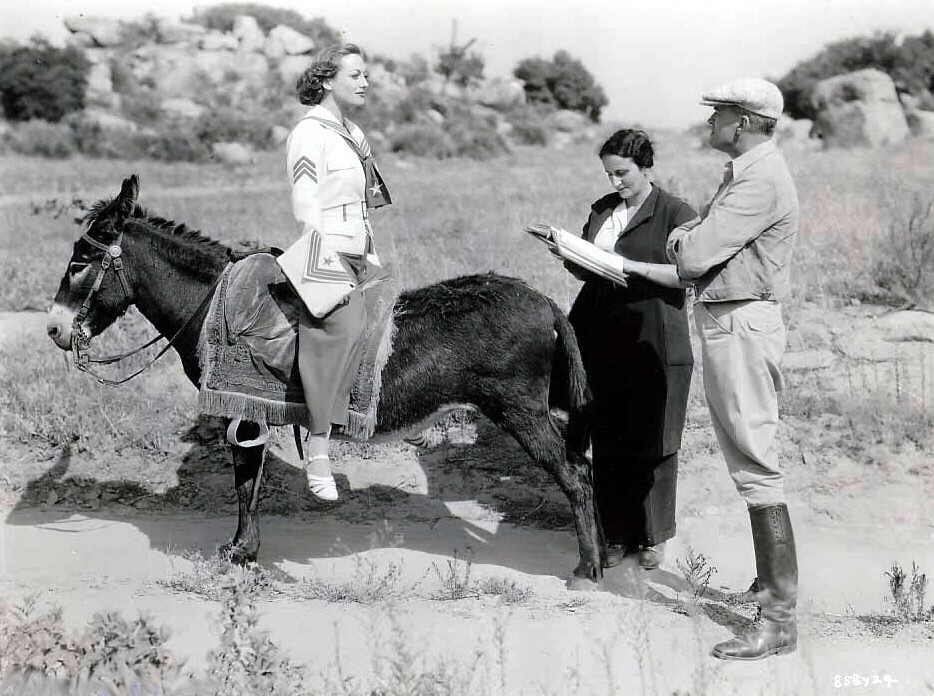 1935. On the set of 'I Live My Life.'