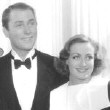 1935. On the set of 'I Live My Life.' Co-star Brian Aherne next to Joan; the rest unknown.