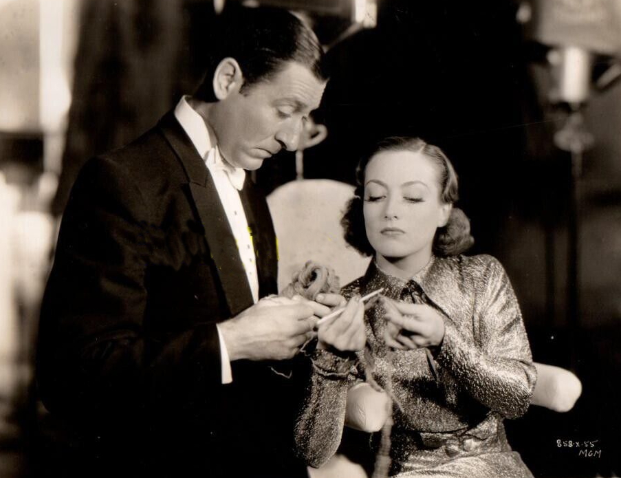 1935. On the set of 'I Live My Life' with Arthur Treacher.