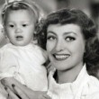 1935. On the set of 'No More Ladies' with niece Joanie.