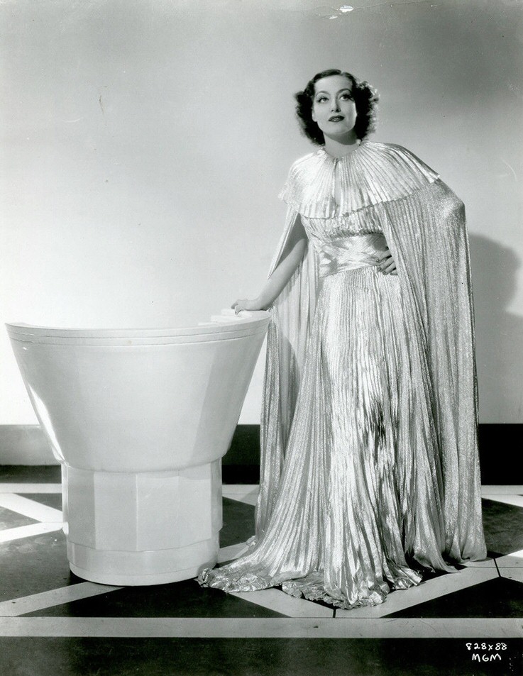 1935. Publicity for 'No More Ladies.' Dress by Adrian.