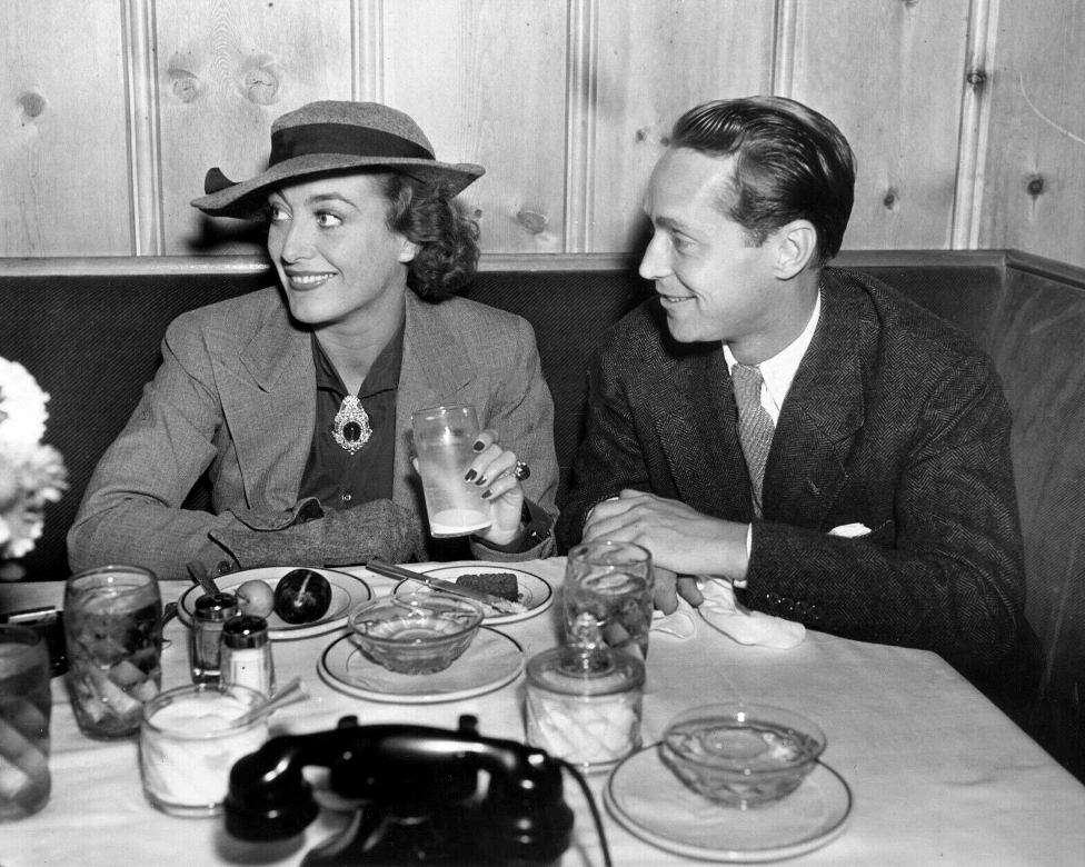 December 1935. At Hollywood's Vendome Cafe with Franchot Tone. Shot by Hyman Fink.