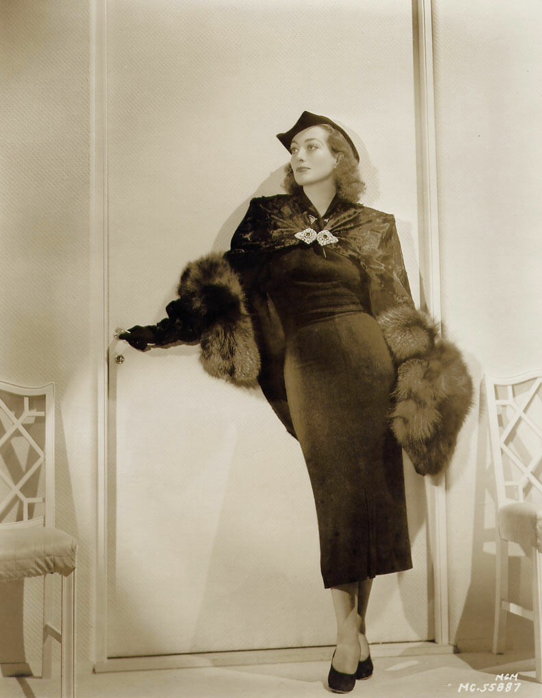 1936. Publicity for 'Love on the Run,' with outfit by Adrian.