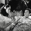1936. 'The Gorgeous Hussy' with Robert Taylor. (Includes press caption.)