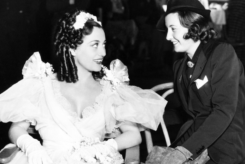 1936. On the set of 'Gorgeous Hussy' with Barbara Stanwyck.