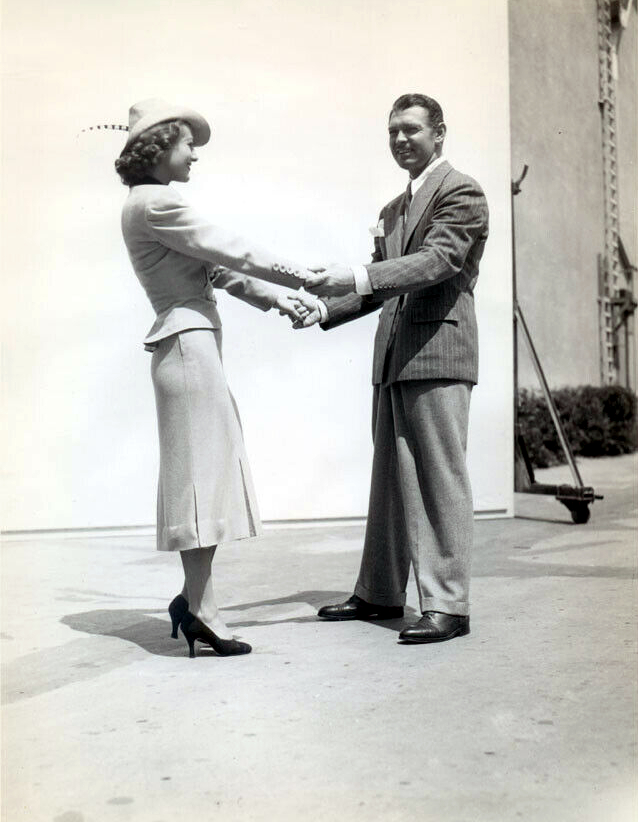 1936. On the set of 'Love on the Run' with Clark Gable.