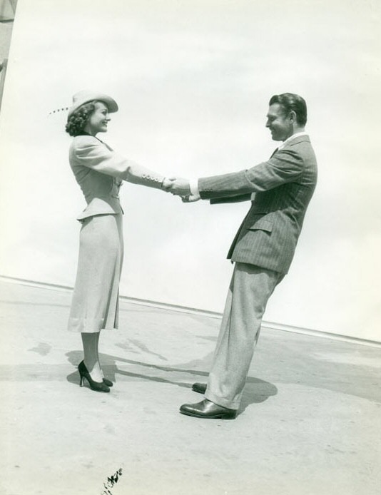 1936. On the set of 'Love on the Run' with Clark Gable.