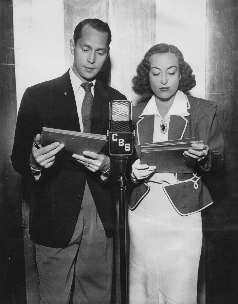 July 1936. Joan and husband Franchot Tone rehearse for the Lux radio show 'Chained.'