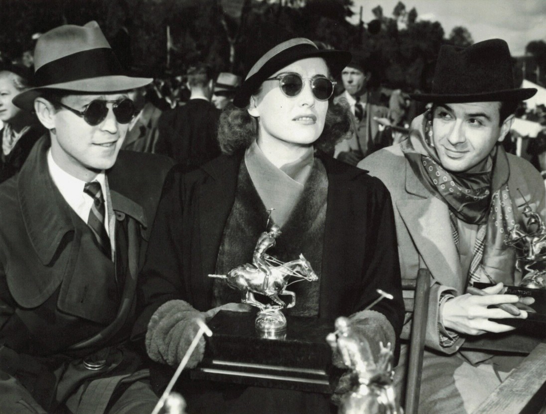 November 1936. At Santa Monica's Will Rogers Memorial Polo Field with husband Franchot Tone and Fred Keating.