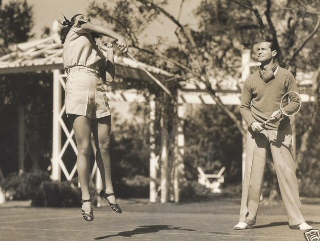 1936. Badminton at home with husband Franchot Tone.
