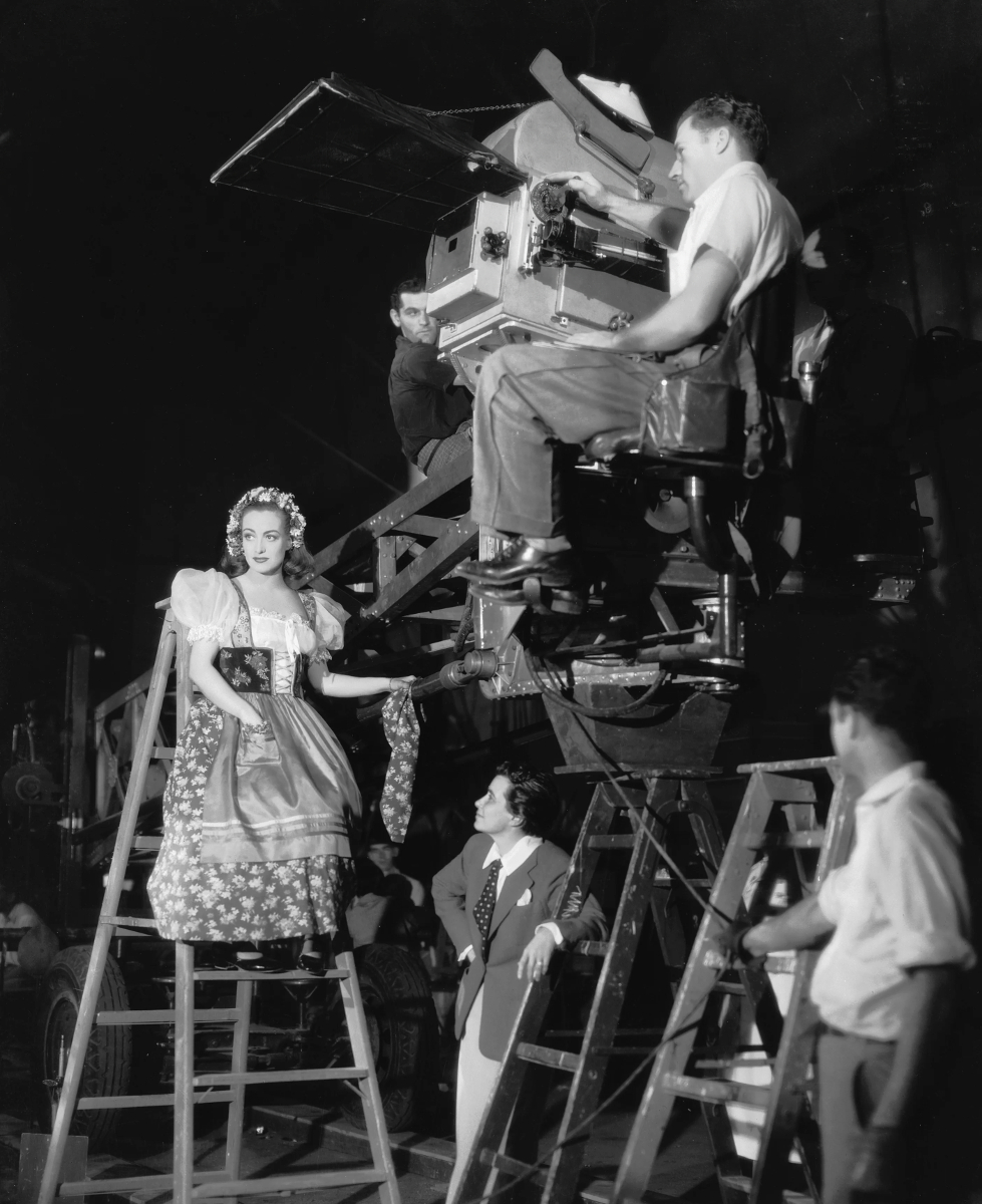 On the set of 'The Bride Wore Red' with director Dorothy Arzner.