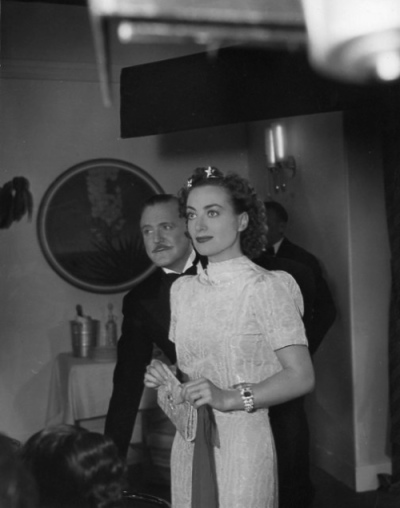 1937. On the set of 'The Last of Mrs. Cheyney' with Frank Morgan.