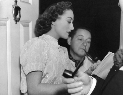1937. On the 'Last of Mrs. Cheyney' set with director Boleslawski and Robert Montgomery.