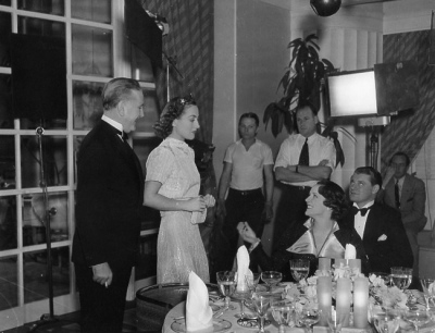 1937. On the set of 'Mrs. Cheyney' with Benita Hume.