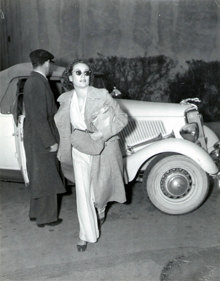 1937. Arriving on the set of 'The Last of Mrs. Cheyney.'