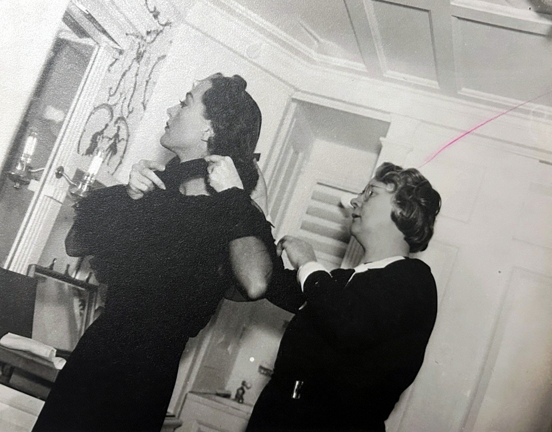 1937. On the set of 'The Last of Mrs. Cheyney' with hairdresser Edith Hubner.