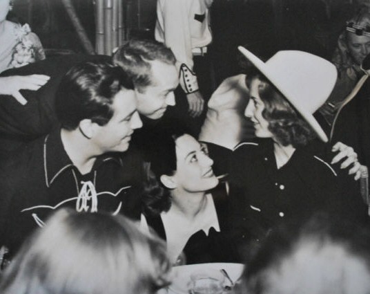 1937. At a Halloween party with Robert Taylor, Franchot Tone, and Barbara Stanwyck.