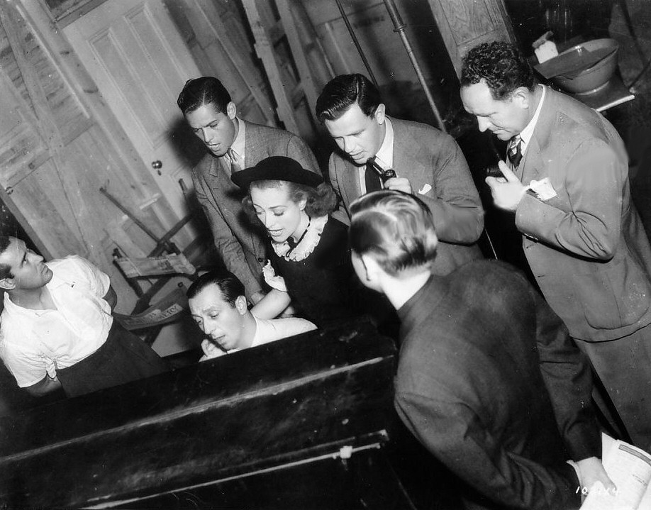 1938. A sing-along on the set of 'Mannequin.'