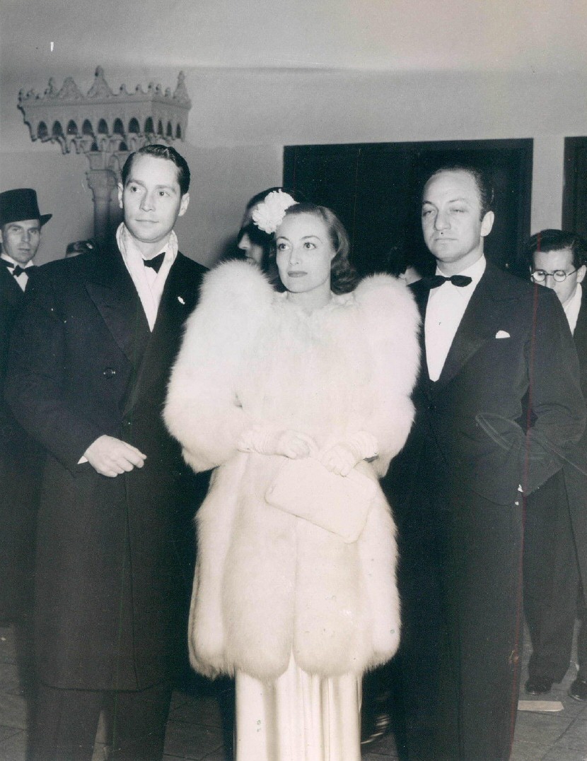 November 1937. At the Los Angeles opera with Franchot Tone and Jerry Asher.