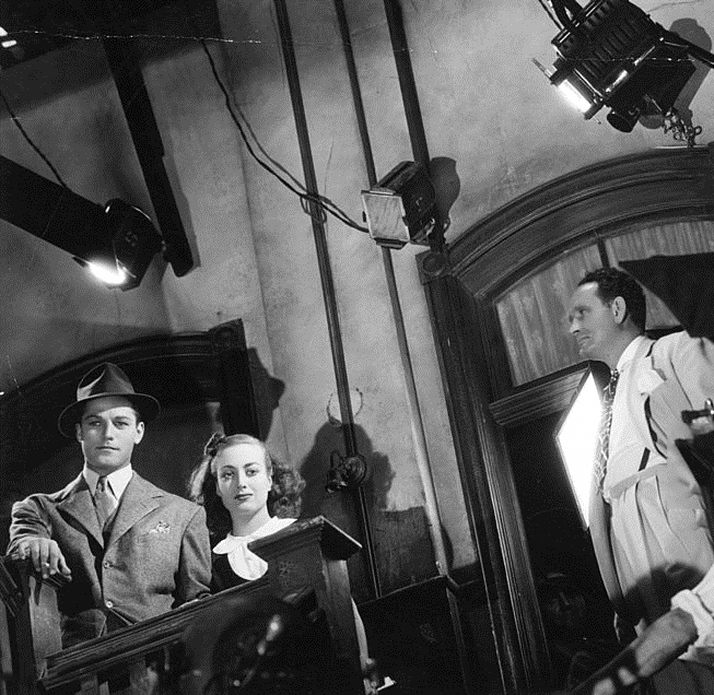 1938. On the set of 'Mannequin' with Alan Curtis and director Borzage.