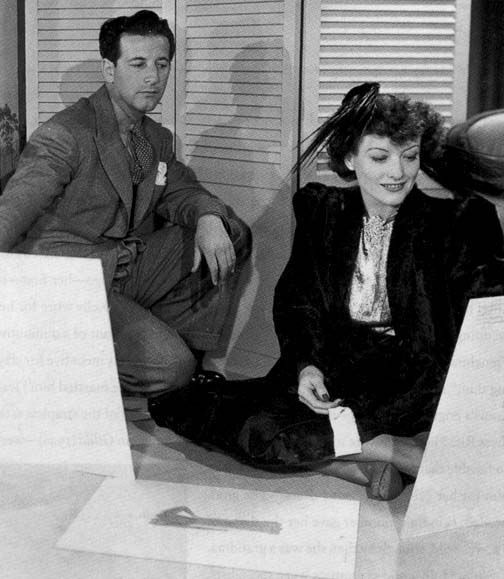 1939. Joan with designer Adrian.