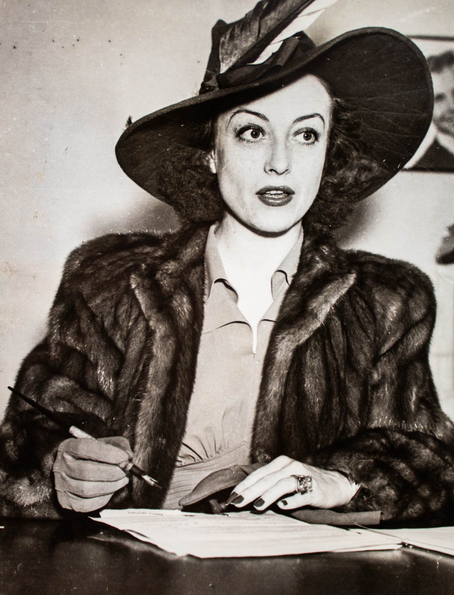 March 1939. In lawyer's office giving deposition in divorce case against Franchot Tone.