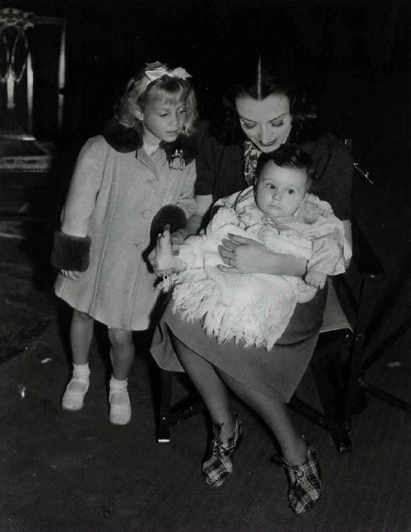 1939. On the set of 'Ice Follies' with niece Joanie LeSueur and unknown baby.