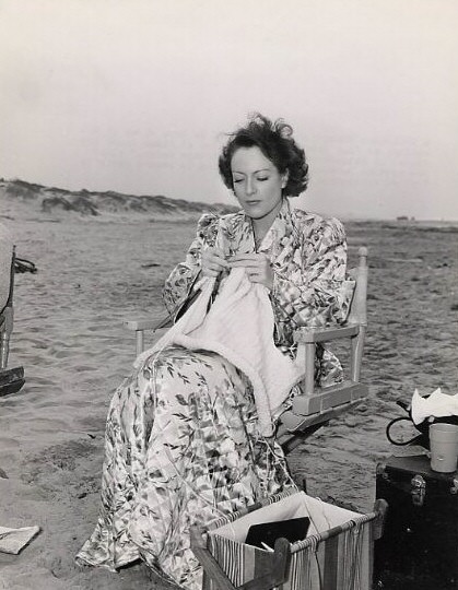 1940. Joan Crawford knitting on the set of 'Strange Cargo.'