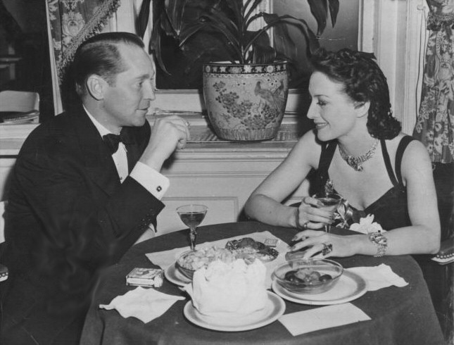 January 1940 at NYC's The Colony restaurant with ex-husband Franchot Tone.