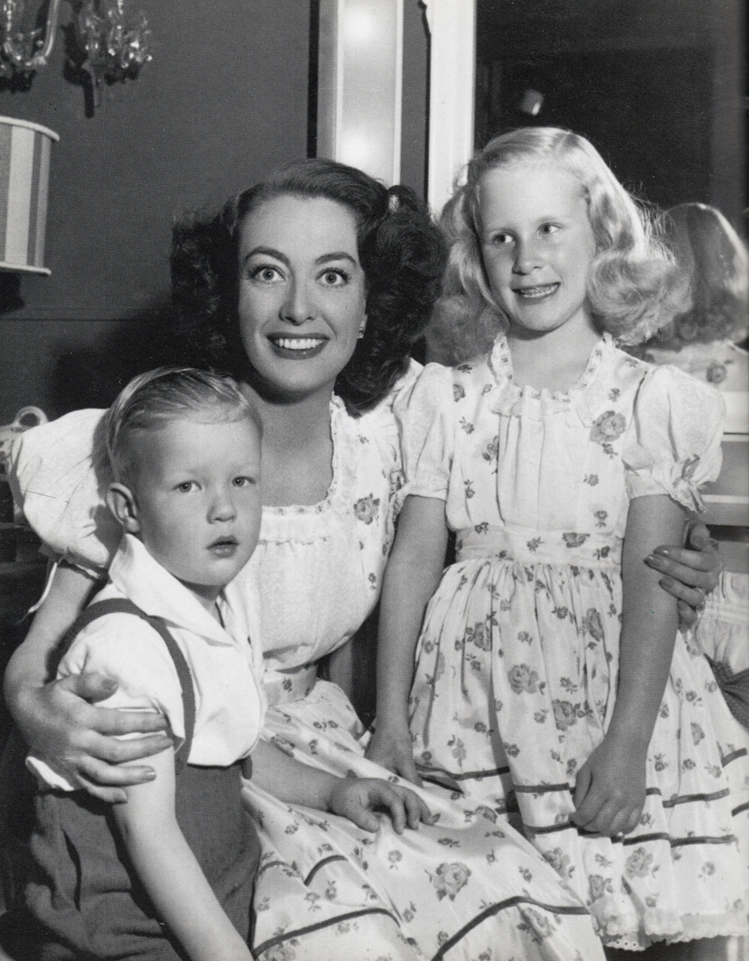 1946. On the set of 'Humoresque' with Christopher and Christina.