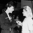 1942. With Judy Garland on the set of 'Reunion in France.'