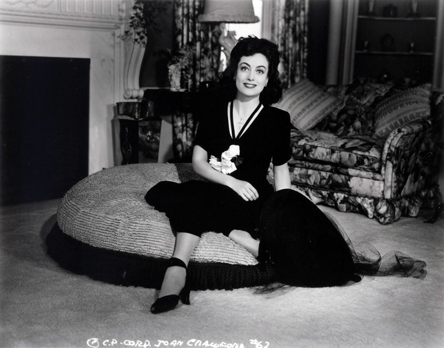 1942. Joan at home. Columbia publicity for 'They All Kissed the Bride.'